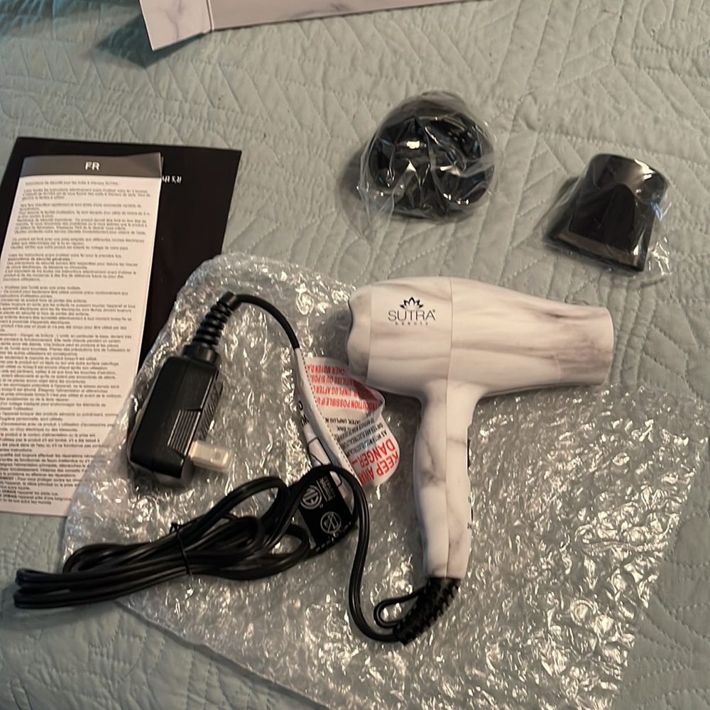 Sutra Travel Hair Dryer with accessories.